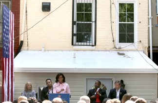 Michelle Obama Helps Paint Army Vet's Home