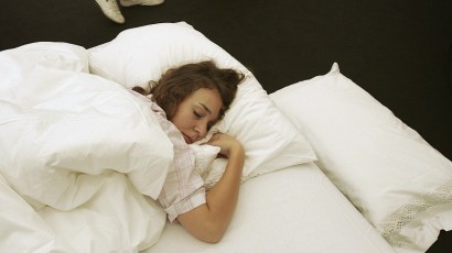 An artwork using a real model entitled 'This is Holly' made from bed, Holly and sleeping pills as displayed in October 2006 in London at The Frieze Art Fair.