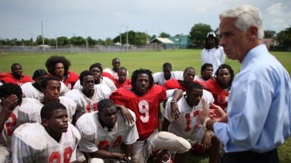 MIAMI - AUGUST 22: Florida Governor Charlie Crist speaks to the football team as he visits Miami-Edison High School August 22, 2007 in Miami, Florida. The Governor visited the school to meet with s MIAMI - AUGUST 22: Florida Governor Charlie Crist speaks to the football team as he visits Miami-Edison High School August 22, 2007 in Miami, Florida. The Governor visited the school to meet with s
