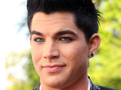 Adam Lambert's label has tried to keep him from being "too gay."