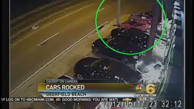 A surveillance video released by the Broward County Sheriffs Office shows a man in jeans and a T-shirt riding a bicycle with another shirt tied around his head. The sheriff's office said the man threw a rock through the windshield of a 2007 black Jaguar and returned six days later to sling a series of rocks at high-end cars.
