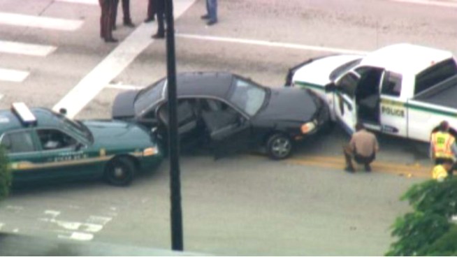 Two men are in custody after a brief police pursuit ended in a collision in southwest Miami-Dade Wednesday morning, authorities said. Det. Alexandra Martinez and resident Johnny Todd spoke about the incident.