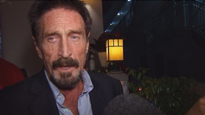 John McAfee, who arrived in Miami just before 7 p.m. Wednesday, explained what happened as he was escorted off his airplane by officers. McAfee, who was expelled from Guatemala, is wanted for questioning by police in Belize in a murder investigation. He said authorities have no evidence against him.