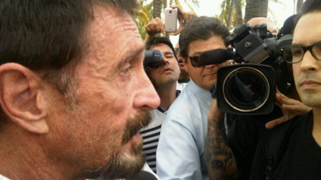 John McAfee, the anti-virus software founder who has evaded Belizean authorities in a homicide investigation, said Thursday that he is glad to be in South Florida. NBC 6 reporter Ari Odzer is among the reporters who spoke to him Thursday in South Beach.