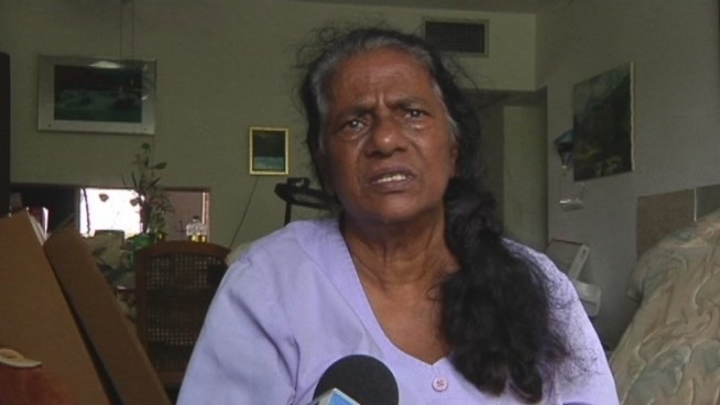 As cleaning crews picked up debris Friday, dripping water and the remains of insulation from a collapsed ceiling could still clearly be seen at the Star Lake apartment building in northeast Miami. Resident Minna Singh explained the problems in her apartment.