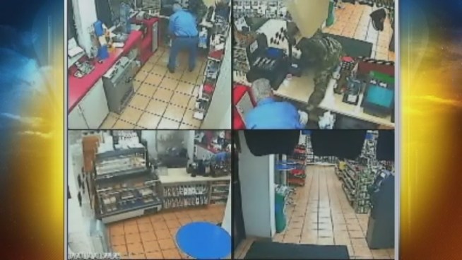 Detective Felix Guadarrama discusses the armed robbery of a Chevron gas station at 13005 Biscayne Blvd. Monday night. The attendant said he was robbed at gunpoint.