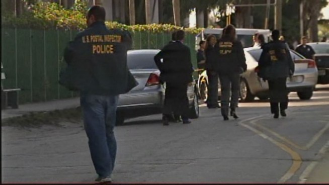 The video released shows the men fleeing the scene of the Dec. 26 incident on foot. Postal inspectors Blanca Alvarez and Ivan Ramirez discussed the case.