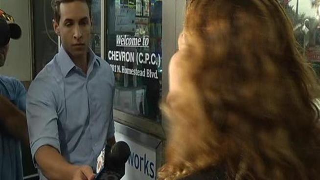 Armed suspect shot by officer in gas station.