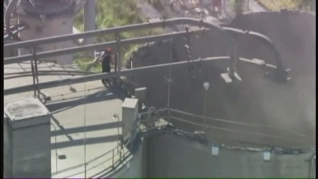 Rescuers were searching for the worker who fell about 140 feet after the roof of a silo collapsed at the Titan America cement plant in Medley Friday morning. Miami-Dade Fire Rescue spokesman Lt. Arnold Piedrahita explained how safety crews on the ground screamed out the man's name from the top of the silo, but did not hear from him. Crews examined the damage from the air and at one point came too close, sending up a cloud of debris.
