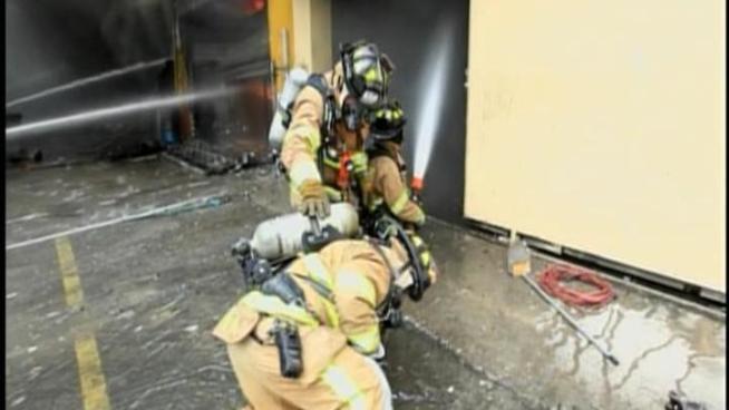 Miami-Dade Fire Rescue battled a four-alarm fire that tore through a warehouse at 7635 NW 27th Ave. Wednesday. The blaze left a burnt shell in its wake after a tense battle that lasted hours.