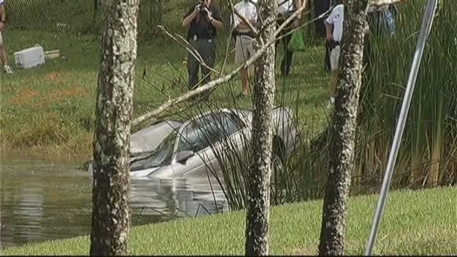 A dead man was found in a car that was discovered floating in a canal at 4100 Wiles Road Tuesday, police said. The man's identity has not been released.