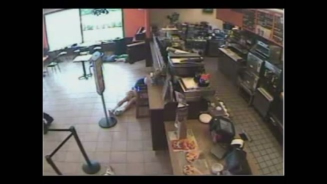 Surveillance video released by Boynton Beach Police shows the robbery at a Dunkin Donuts.