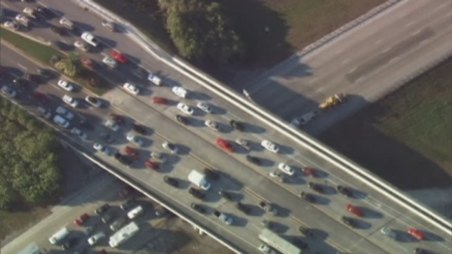 Traffic was snarled along Southbound Interstate 75 during rush hour Friday after a rollover crash.