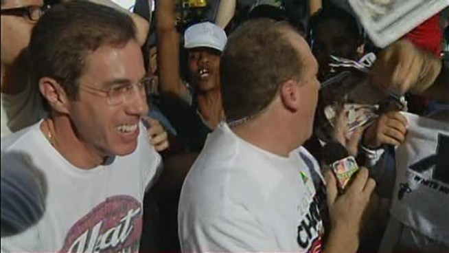 NBC 6's Steve Litz and Ari Odzer talk to fans outside the AmericanAirlines Arena after the Miami Heat beat the Thunder, becoming the 2012 NBA champions.