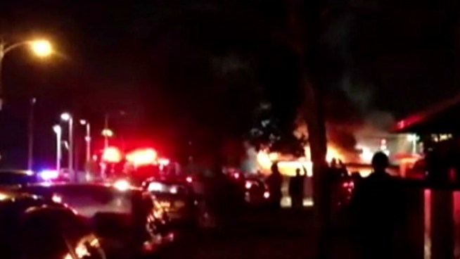 Firefighters are trying to figure out what sparked flames at a used-car lot where suspicious fires have happened before. NBC 6 reporter Julia Bagg spoke to Mario Garzon, who escaped the flames.