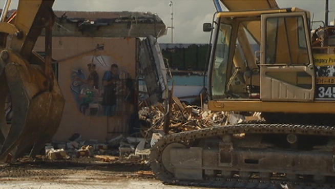 A Liberty City business owner was brought to tears after watching his shop turn to rubble Friday. NBC 6 reporter Sharon Lawson spoke to Tyrone Greene, the owner of Greene Dreams Shoe Repair. Miami-Dade County spokeswoman Karla Damian also was interviewed.