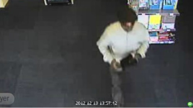 Wednesday, Broward sheriff's detectives released surveillance video of the man robbing employees at gunpoint at a FedEx store in Pompano Beach on Dec. 13. Detectives are seeking the public's help to identify him.