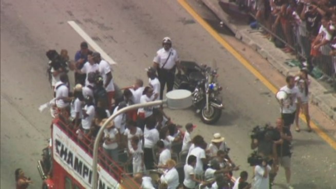 Miami streets were full of fans as the Miami Heat players waved from the top of red buses.