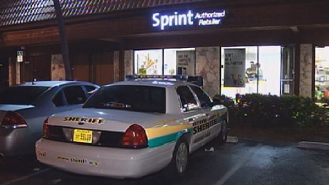 Authorities were searching for three masked gunmen who robbed a Pompano Beach Sprint store and handcuffed its employees. Store manager Michael Decristoforo was working Sunday and said he did his best to keep the peace.