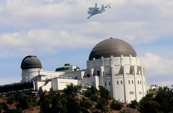 Watch as the retired space shuttle Endeavour soars over SoCal landmarks like the Hollywood sign and Griffith Observatory on Sept. 21, 2012.
