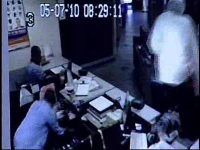 Armed crooks ransack a Post Office on Friday.