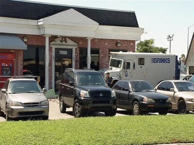 Gunshots erupted and a security guard was killed after a trio of robbers targeted a Brinks armored truck outside a Miramar Bank of America Friday.