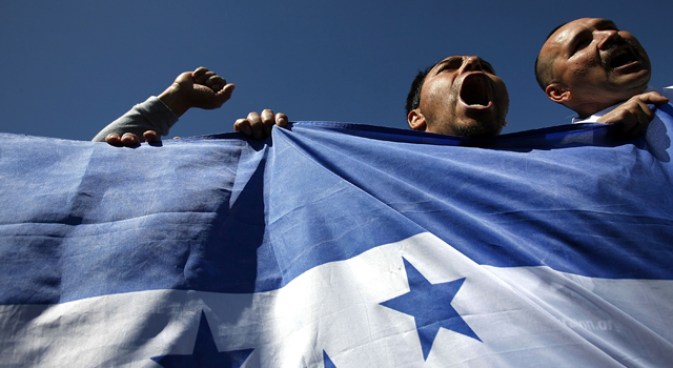 Hundreds Celebrate Fourth by Waving Foreign Flags