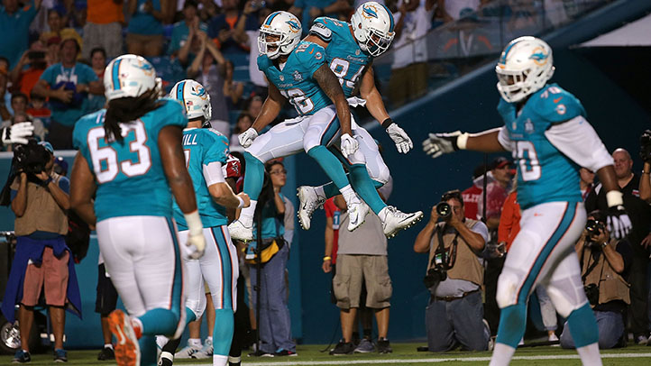 Dolphins Take Down Falcons in Close Battle