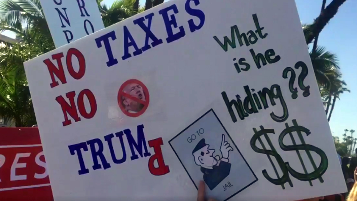“Show Your Taxes!”: Tax Day Protesters Gather in Miami