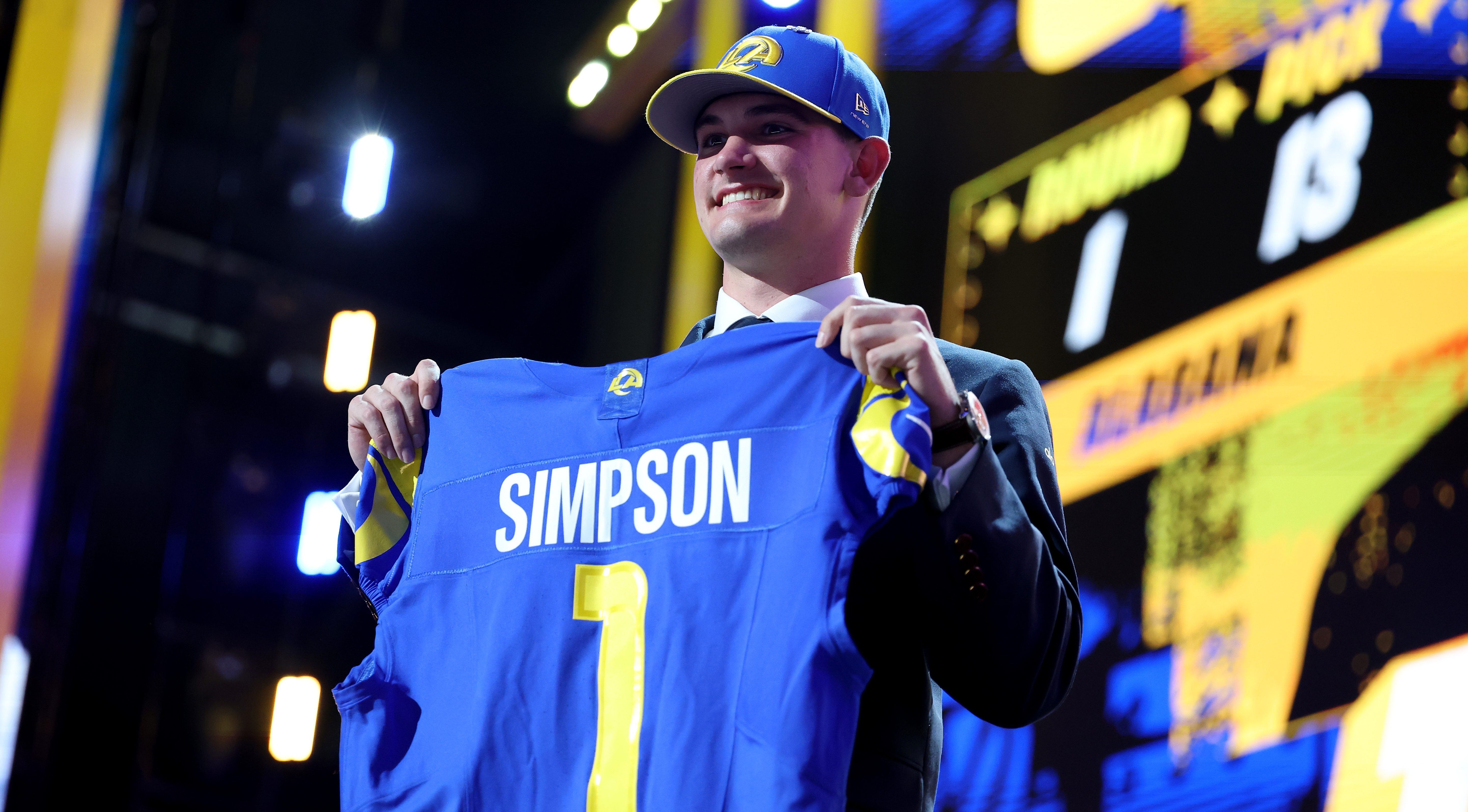 Ty Simpson of Alabama celebrates after being taken.