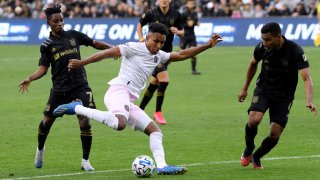 LOS ANGELES, CALIFORNIA – MARCH 01: Juan Agudelo #12 of Inter Miami CF attempts a shot in front of Latif Blessing #7 and Eddie Segura #4 of Los Angeles FC during a 1-0 Los Angeles FC win at Banc of California Stadium on March 01, 2020 in Los Angeles, California. (Photo by Harry How/Getty Images)