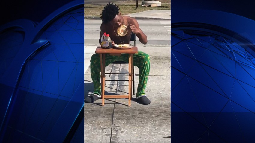 032417 lakeland man eats pancakes in road