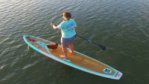 101717 Keys Woman Paddleboards with Chicken