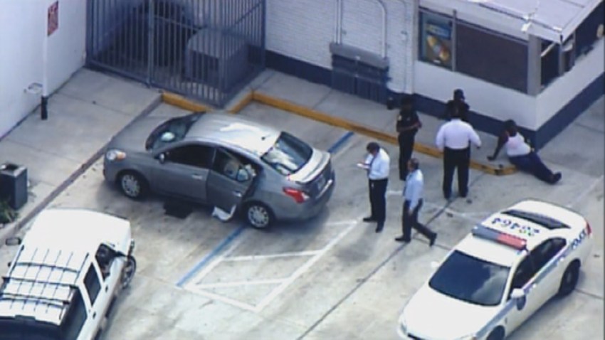 102913 body in back seat miami