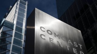 FILE- This May 21, 2018, file photo shows a sign outside the Comcast Center, which Liberty Property Trust built, in Philadelphia.