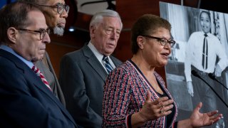 From left, House Judiciary Committee Chairman Jerrold Nadler, D-N.Y., Rep. Bobby Rush, D-Ill., House Majority Leader Steny Hoyer, D-Md., and Rep. Karen Bass, D-Calif., chair of the Congressional Black Caucus, hold a news conference to discuss the "Emmett Till Antilynching Act" which would designate lynching as a hate crime under federal law, on Capitol Hill in Washington, Wednesday, Feb. 26, 2020. Emmett Till, pictured at right, was a 14-year-old African-American who was lynched in Mississippi in 1955, after being accused of offending a white woman in her family's grocery store. (AP Photo/J. Scott Applewhite)