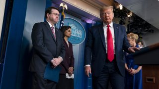 President Trump and other officials during a White House briefing