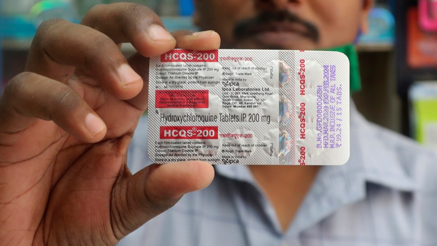 In this Tuesday, May 19, 2020 file photo, a chemist holds a pack of hydroxychloroquine tablets in Mumbai, India. A Friday, May 22, 2029 report in the journal Lancet shows malaria drugs pushed by U.S. President Donald Trump as treatments for the coronavirus not only did not help but were tied to a greater risk of death and heart rhythm problems in a study of nearly 100,000 patients around the world.