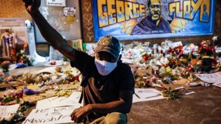 In this Monday, June 1, 2020 file photo, protesters gather at a memorial for George Floyd where he died outside Cup Foods on East 38th Street and Chicago Avenue in Minneapolis.