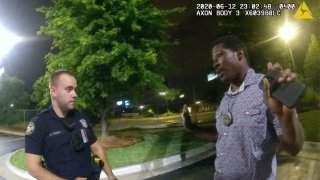This screen grab taken from body camera video provided by the Atlanta Police Department shows Rayshard Brooks speaking with Officer Garrett Rolfe