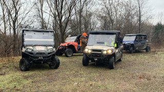 Cars arrive near the scene where 14 horses were shot dead in Floyd County, Kentucky, Dec. 19, 2019.