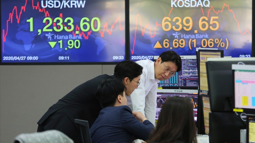 In this April 27, 200, file photo, currency traders watch monitors at the foreign exchange dealing room of the KEB Hana Bank headquarters in Seoul, South Korea.
