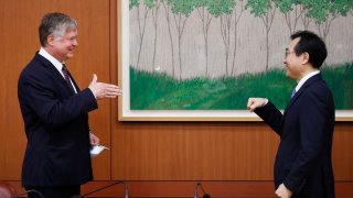 U.S. Deputy Secretary of State Stephen Biegun, left, is greeted by his South Korean counterpart Lee Do-hoon during their meeting at the Foreign Ministry in Seoul Wednesday, July 8, 2020. Biegun is in Seoul to hold talks with South Korean officials about allied cooperation on issues including North Korea.