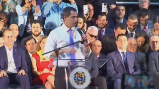 Juan Guaidó greets his audience at the Miami Airport Convention Center on February 1, 2020.