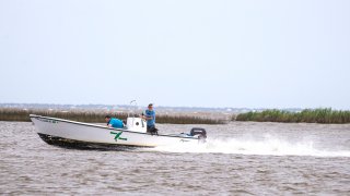 A boat runs up the Apalachicola River prior to the arrival of Hurricane Michael on October 9, 2018 in Apalachicola, Florida. The hurricane is forecast to hit the Florida Panhandle at a possible category 3 storm. (Photo by Mark Wallheiser/Getty Images)