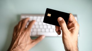 A man using credit card, online shopping / electronic banking