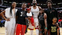 MIAMI, FLORIDA - APRIL 09: Dwyane Wade #3 of the Miami Heat poses for a photo with his wife, Gabrielle Union, nephew, Dahveon Morris, and children, Kaavia James Union Wade, Zaire Wade, Xavier Wade and Zion Wade after his final career home game at American Airlines Arena on April 09, 2019 in Miami, Florida. NOTE TO USER: User expressly acknowledges and agrees that, by downloading and or using this photograph, User is consenting to the terms and conditions of the Getty Images License Agreement. (Photo by Michael Reaves/Getty Images)