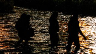 Central American migrants cross the Rio Grande river in Ciudad Juarez, state of Chihuahua, Mexico, on June 12, 2019, before turning themselves in to U.S. Border Patrol agents to ask for asylum.