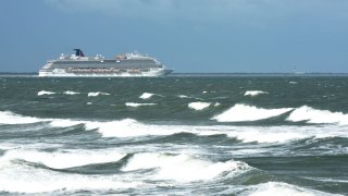 File phoThe Carnival Breeze cruise ship heads out to sea as rough surf generated by the Tropical Storm Humberto is seen as the storm moves north off the coast of Florida. (Photo by Paul Hennessy/SOPA Images/LightRocket via Getty Images)