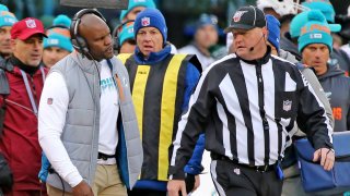 Miami Dolphins coach Brian Flores talks with an official in the third quarter as they play the New York Jets on Sunday, Dec. 8, 2019 at MetLife Stadium in East Rutherford, NJ. (Charles Trainor Jr./Miami Herald/Tribune News Service via Getty Images)